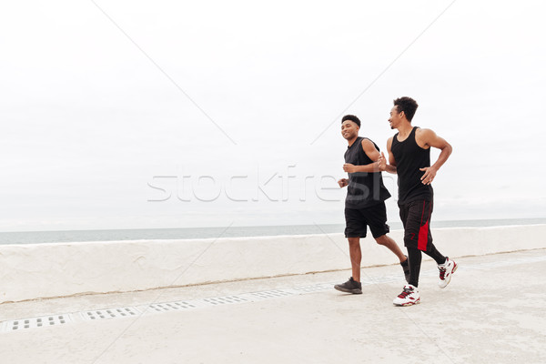 Afrikai sportok férfiak barátok fut kint Stock fotó © deandrobot