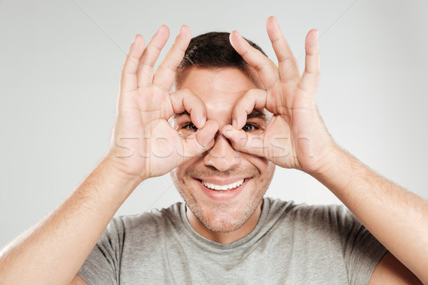 Man looking camera have fun. Stock photo © deandrobot