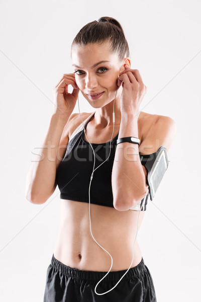 Stock foto: Porträt · freudige · Fitness · Frau · Sportbekleidung · Musik · hören · Kopfhörer