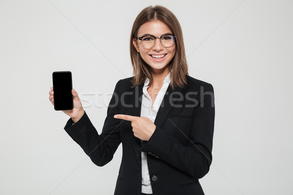 Portrait souriant heureux femme d'affaires lunettes costume [[stock_photo]] © deandrobot