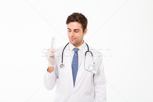 портрет улыбаясь молодые мужской доктор стетоскоп равномерный Сток-фото © deandrobot