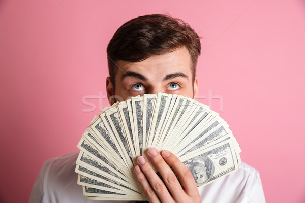 Porträt junger Mann weiß Shirt Gesicht Geld Stock foto © deandrobot