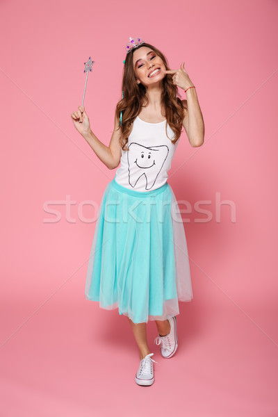Full-length photo of overjoyed birthday girl in diadem holding m Stock photo © deandrobot