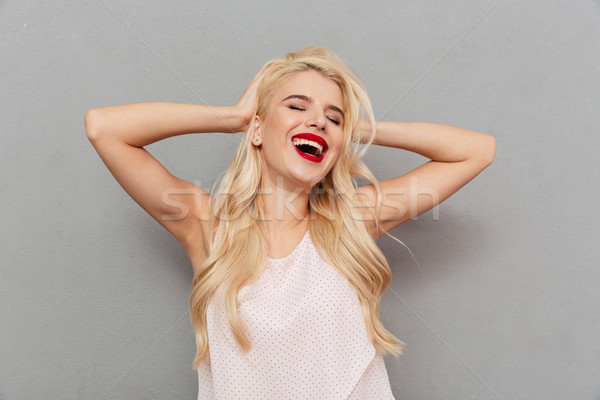 Portrait of a happy woman laughing Stock photo © deandrobot