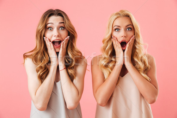 Two shocked pretty women in pajamas screaming Stock photo © deandrobot