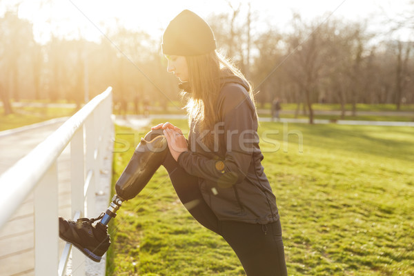 Image of disabled athletic girl in sportswear, doing sports and  Stock photo © deandrobot
