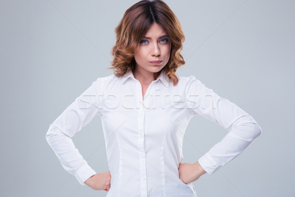 Portrait of a cute offended woman Stock photo © deandrobot