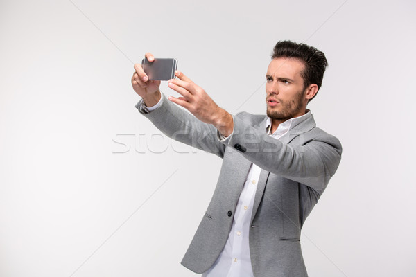 Businessman making selfie photo Stock photo © deandrobot