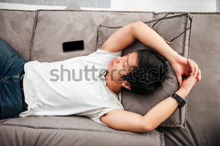 Lovely woman lying on the bed Stock photo © deandrobot