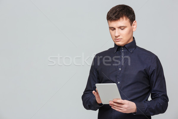 Businessman using tablet computer Stock photo © deandrobot
