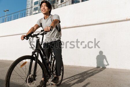 Alegre mulher equitação bicicleta ao ar livre praia Foto stock © deandrobot