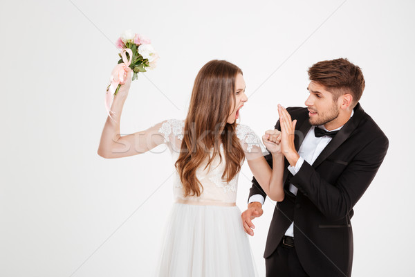 Jovem recém-casados conflito branco mãos amor Foto stock © deandrobot