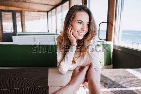 Happy Woman in cafe near the sea Stock photo © deandrobot