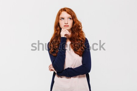 Young lady isolated over white background while drinking Stock photo © deandrobot