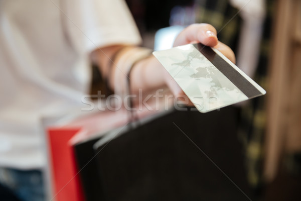 Kép fiatal nő tart debitkártya áll ruházat Stock fotó © deandrobot