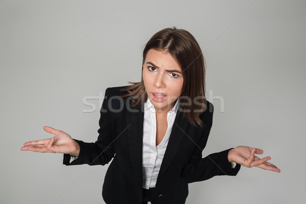 Portrait of a confused frustrated businesswoman Stock photo © deandrobot