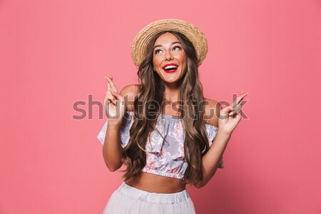 Happy woman smiling isolated over pink Stock photo © deandrobot