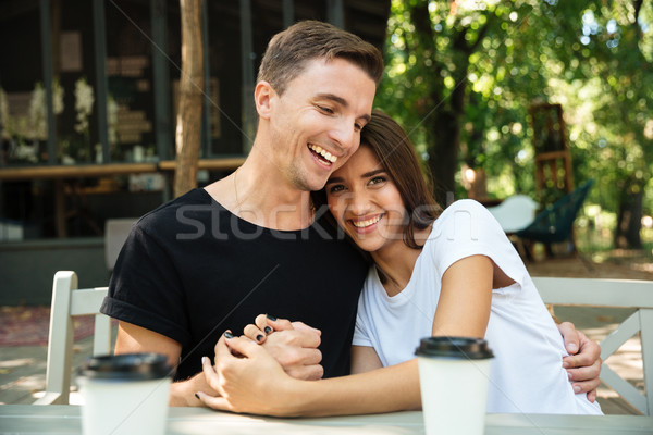 Portrait of a cheery attractive couple drinking coffee Stock photo © deandrobot
