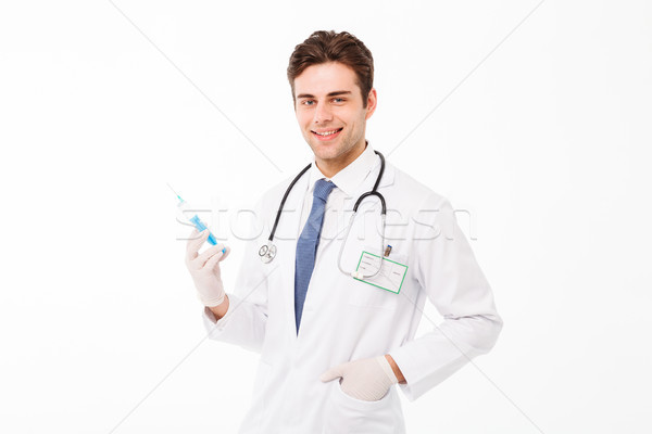Portrait of a smiling young male doctor with stethoscope Stock photo © deandrobot