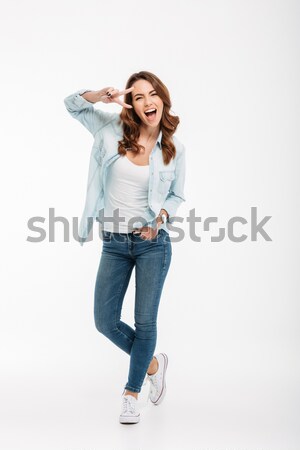 PFull length prtrait of a funny girl dressed in tank-top Stock photo © deandrobot