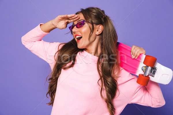 Portrait of a happy girl in sweatshirt posing Stock photo © deandrobot