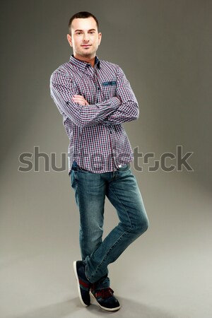 Tam uzunlukta portre adam ayakta gri eller Stok fotoğraf © deandrobot