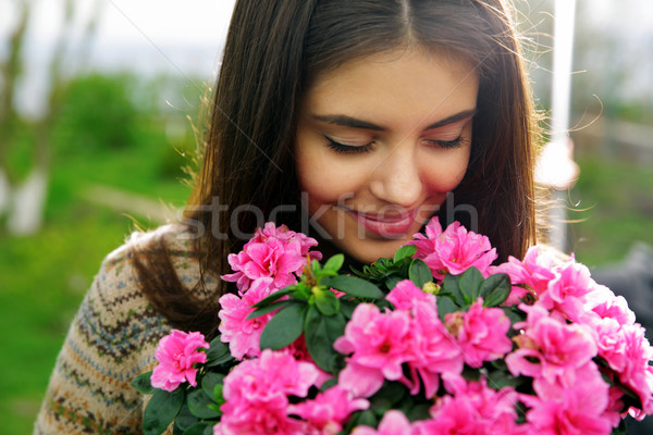 Jovem bela mulher flores primavera feliz olhos Foto stock © deandrobot