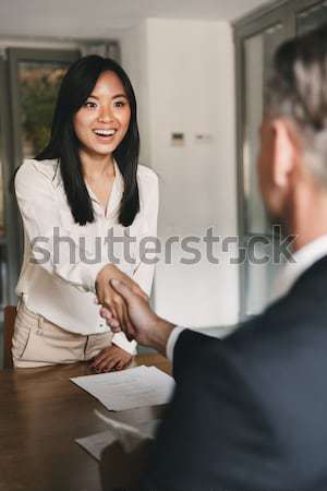 Sorrindo sessão reunião de negócios colegas escritório mulher Foto stock © deandrobot