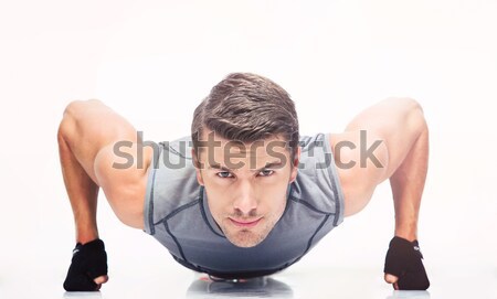 Sports young man doing push ups Stock photo © deandrobot