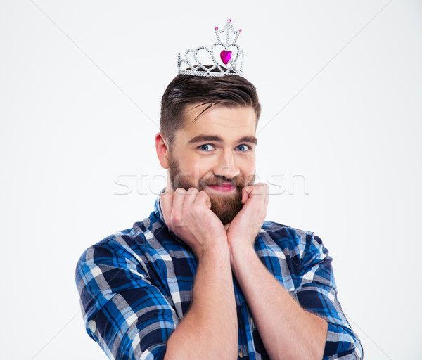 Portrait of a happy feminine man in queen crown Stock photo © deandrobot
