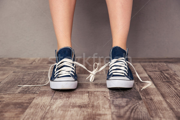 Human legs in sneakers Stock photo © deandrobot