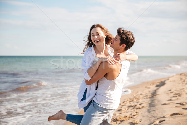 Coppia amore ridere spiaggia felice Foto d'archivio © deandrobot