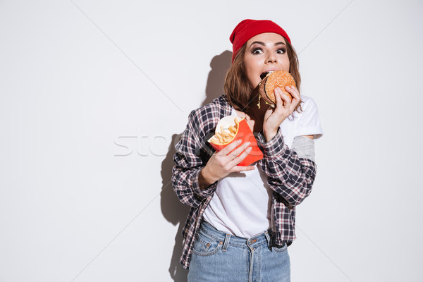 Hungrig Essen frites burger Foto Stock foto © deandrobot