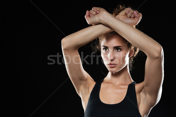Fitness woman covering himself with hands Stock photo © deandrobot