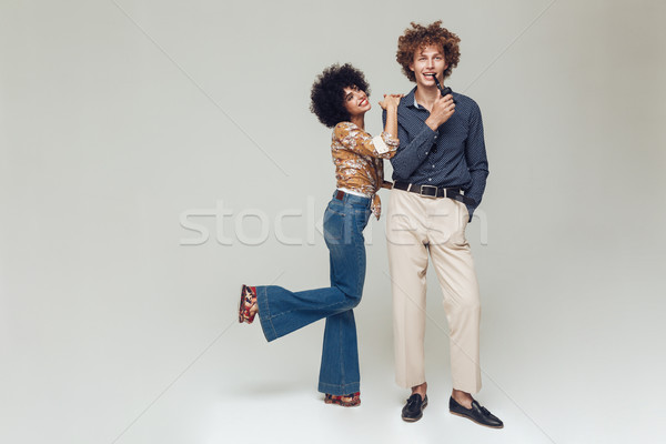 Emotional retro loving couple posing isolated. Looking camera. Stock photo © deandrobot