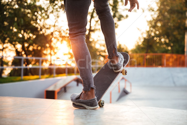 Cropped image of a skater boy practicing Stock photo © deandrobot