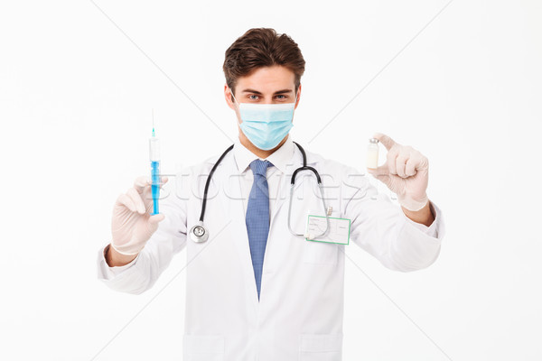 Close up portrait of a confident young male doctor Stock photo © deandrobot