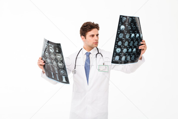 Portret zagęszczony młodych mężczyzna lekarz stetoskop uniform Zdjęcia stock © deandrobot