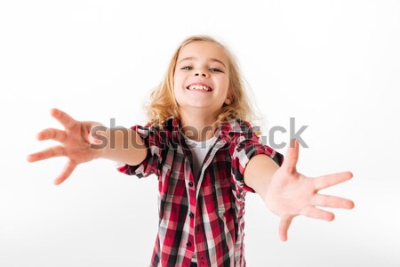 Portrait of a friendly little girl with outstretched hands Stock photo © deandrobot