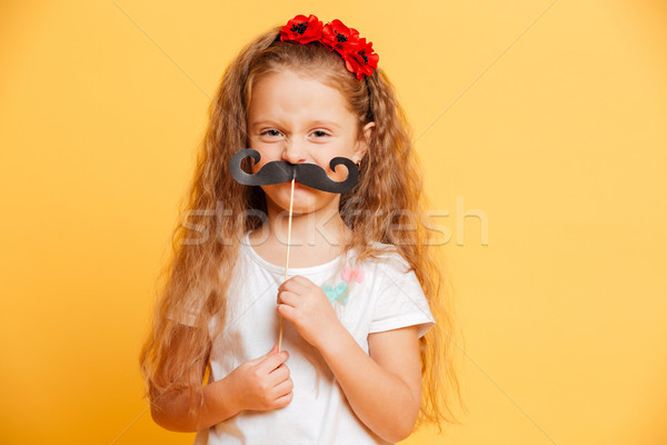 Amuzant fetita fals mustata uita Imagine de stoc © deandrobot