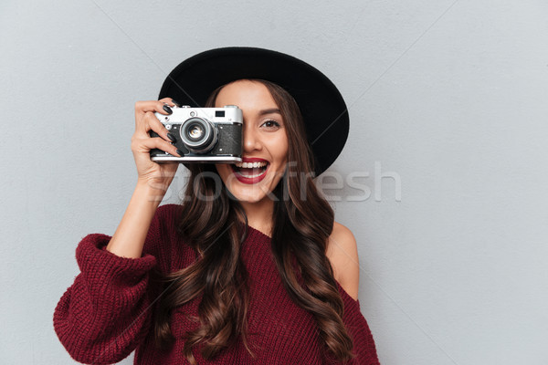 Close-up portrait of young hipster brunette woman looking throug Stock photo © deandrobot