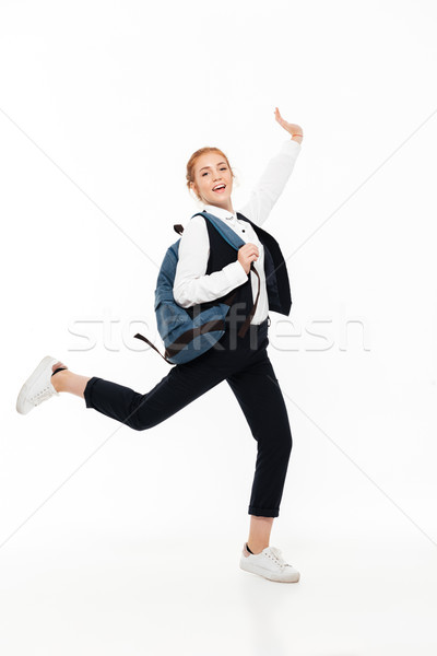 Image heureux étudiant femme sac à dos [[stock_photo]] © deandrobot