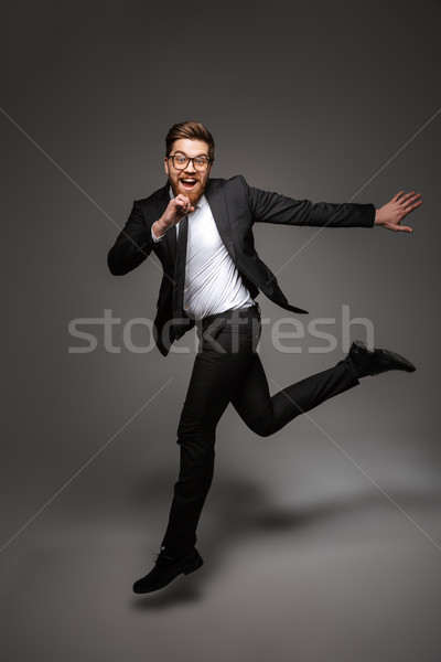 портрет счастливым молодые бизнесмен костюм Сток-фото © deandrobot