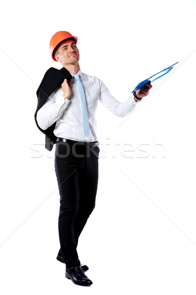 Portrait of a businessman in helmet giving folder over white background Stock photo © deandrobot