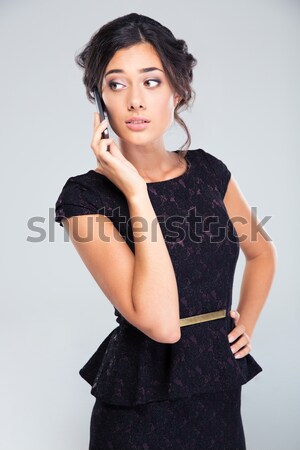 Retrato encantador mujer vestido negro pie gris Foto stock © deandrobot