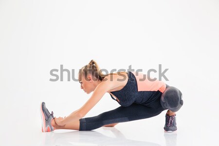 Woman doing stretching exercises  Stock photo © deandrobot