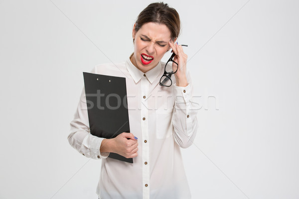 Deprimido infeliz jovem mulher de negócios sofrimento dor de cabeça Foto stock © deandrobot