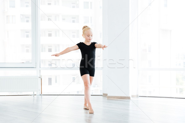 Young little ballet dancing student at a class Stock photo © deandrobot