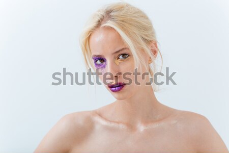 Half face of beautiful young woman with purple stylish makeup Stock photo © deandrobot