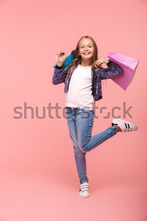 Young woman drinking aerated sweet water. Stock photo © deandrobot